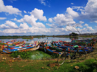 Colorful kayaks on the beach near the U Bein Bridge, Mandalay, Myanmar