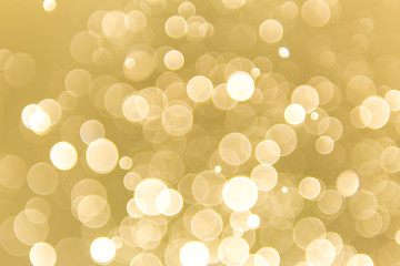 abstract gold background with soft blur bokeh light effect, background bokeh