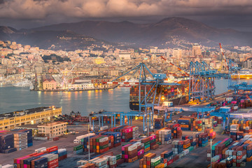 Genova, Genoa, Italy: Aerial view of shipping and container terminal, stacked containers and loading dock side cranes in the port of Genoa, Magazzini del cotone and Porto Antico, sea - obrazy, fototapety, plakaty
