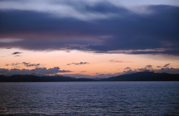 Dramatic cloudy sunset above Sevan Lake. Armenia.