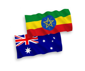 National vector fabric wave flags of Australia and Ethiopia isolated on white background. 1 to 2 proportion.