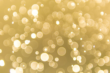 abstract gold background with soft blur bokeh light effect, background bokeh