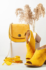 Yellow female fashion accessories, shoes, sunglasses and handbag. Beauty, shopping, urban outfit...