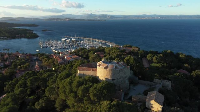 Aerial view of Porquerolles island in National park of Port Cros, the village and harbor of Porquerolles seen from the castle Sainte Agathe