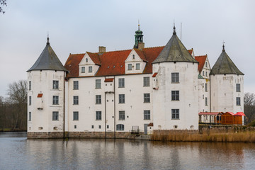 Fototapeta na wymiar Glücksburg Castle from the side by the water and bad weather