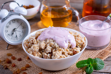 Healthy Breakfast Oatmeal Porridge Bowl with yoghurt
