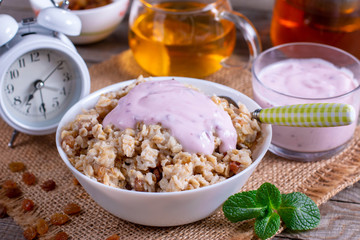 Healthy Breakfast Oatmeal Porridge Bowl with yoghurt