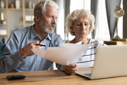 Elderly couple manage budget having unpaid debts feels stressed