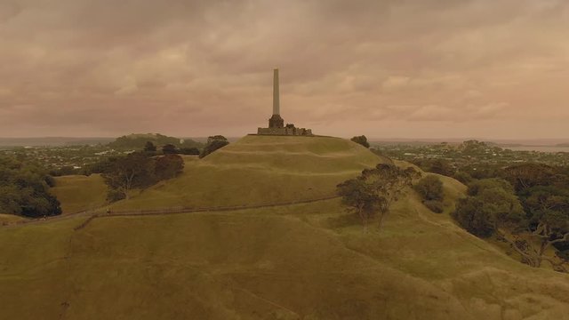 Aerial: One Tree Hill and orange skies created from the Australian bush fires that swept accross the Tasman Sea.  Auckland, New Zealand.  5 January 2019