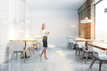 Woman in white modern restaurant