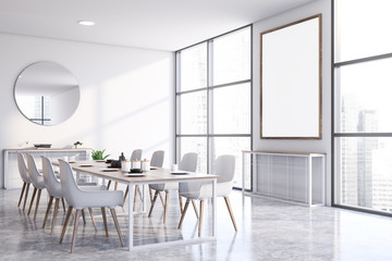 White dining room corner with poster