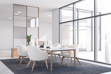 White dining room corner with armchairs