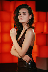 Naklejka premium girl in a beautiful evening dress posing sexy