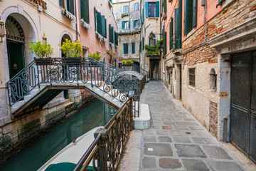Fototapeta na wymiar Street and canal in Venice, Italy