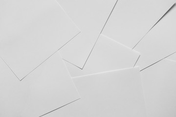 Heap of scattered white empty clean blank paper sheets. Top view, horizontal. Template for posters....