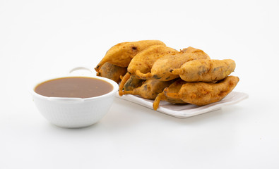 Indian Street Fried Food Spicy Chilli Pakora Served With Sauce & Chutney Also Know as Mirchi Bajji, Mirchi Vada, Mirchi Bada, Chili Cutlet or Chili Bajji It's a Popular Tea Time Snacks From India