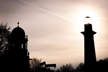 silhouette of a church at sunset