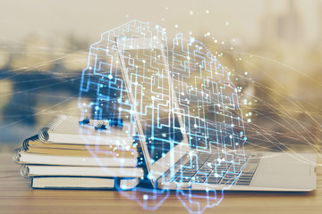 Multi exposure of work table with computer and brain hologram. Brainstorm concept.