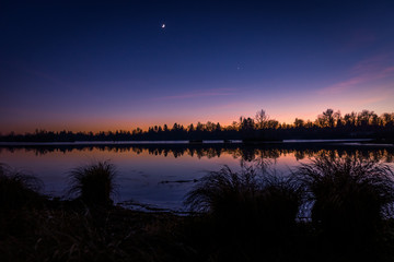 Colorful sky and colorful water in lake reflected in evening, panorama