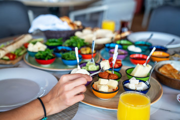 Obraz na płótnie Canvas A delicious mediterranean breakfast accompanied by freshly squeezed orange juice for a healthy life.