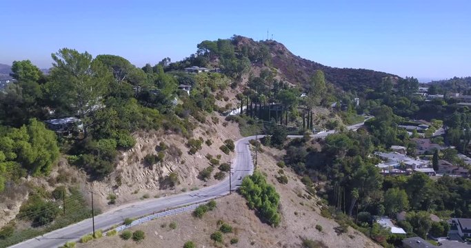 4k drone aerial footage motorcycle rider through hollywood hills mulholland drive los angeles california