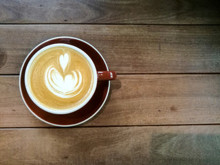 cup of coffee on wooden table