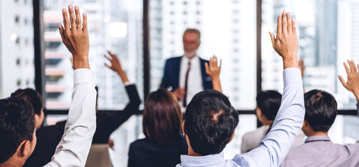 Businessman standing in front of group of people in consulting meeting conference seminar and...