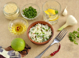 Basmati rice with lime, cilantro and garlic in ceramic bowls