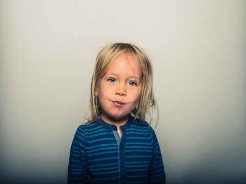 Portrait of toddler pulling faces