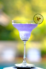 blue cocktail with lime