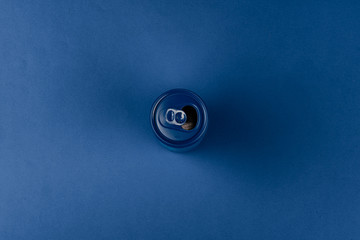 Aluminum can on classic blue background, top view