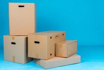 Stack of cardboard boxes on blue background