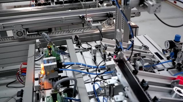 Close-up of the products which are automatically classified according to their color in storage station. Industry 4.0 smart factory concept; artificial intelligence in autonomous production.