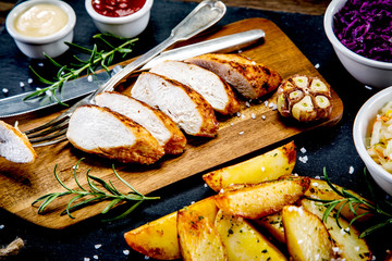  Barbecue chicken fillet with baked potatoes and vegetables