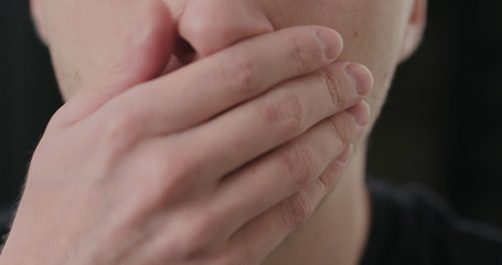 closeup shot of man taking pill