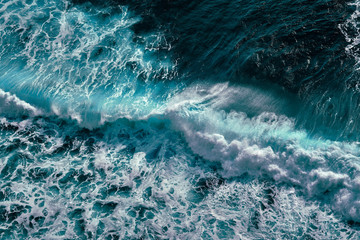 Aerial view to ocean waves. Blue water background - 313391507
