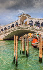 Fototapeta na wymiar Rialto bridge and Grand Canal in Venice, Italy. The Rialto Bridge (Ponte di Rialto), the oldest of the four bridges spanning the Grand Canal in Venice, Italy.