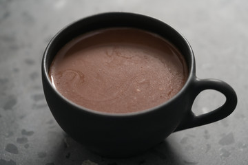 simple cup of hot chocolate drink on terrazzo background