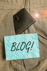 Text sign showing Blog. Business photo showcasing regularly updated website or web page run by an individual or group Small little wallet inside man trousers front pocket near notation paper