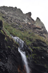 Fototapeta na wymiar The waterfall at Tregardock Beach North Cornish Coast