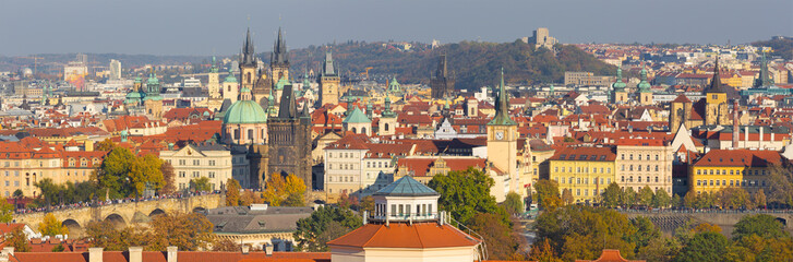 Fototapeta na wymiar Prague - The panorama of the city with the Charles bridge and the Old Town in evening light.