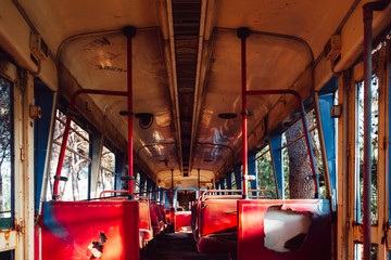 Interior of an old abandoned, dirty and shattered train car.