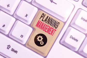 Writing note showing Planning Management. Business concept for act or process of making or carrying...