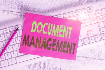 Handwriting text writing Document Management. Conceptual photo Computerized analysisagement of electronic documents White keyboard office supplies empty rectangle shaped paper reminder wood