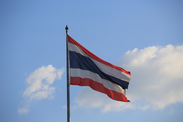 waving Thailand flag at outdoor, blue sky background