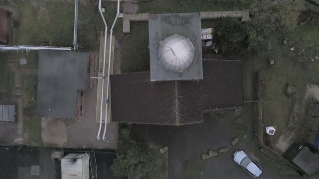 Aerial view above Leighton Observatory silver dome building & Pex Hill woodland walking trail. Pull back landscape reveal.