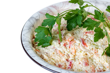 salad of rice, vegetables with mayonnaise in a bowl on a white background