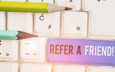 Conceptual hand writing showing Refer A Friend. Concept meaning direct someone to another or send him something like gift