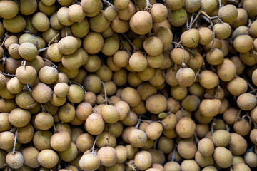 Pile Of Longan Fruit For Sell at Food Market, Thailand, Close Up