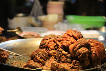 Soy sauce pig leg on dish in thailand night market